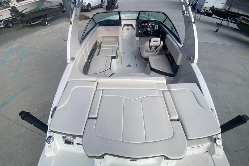 Slide: The Image of 2017 Chaparral 227 SSX boat interior with spacious seating and modern dashboard. - 15
