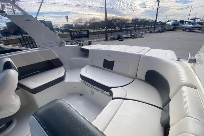 Slide: The Image of 2017 Chaparral 227 SSX boat interior with white and black seating. - 18