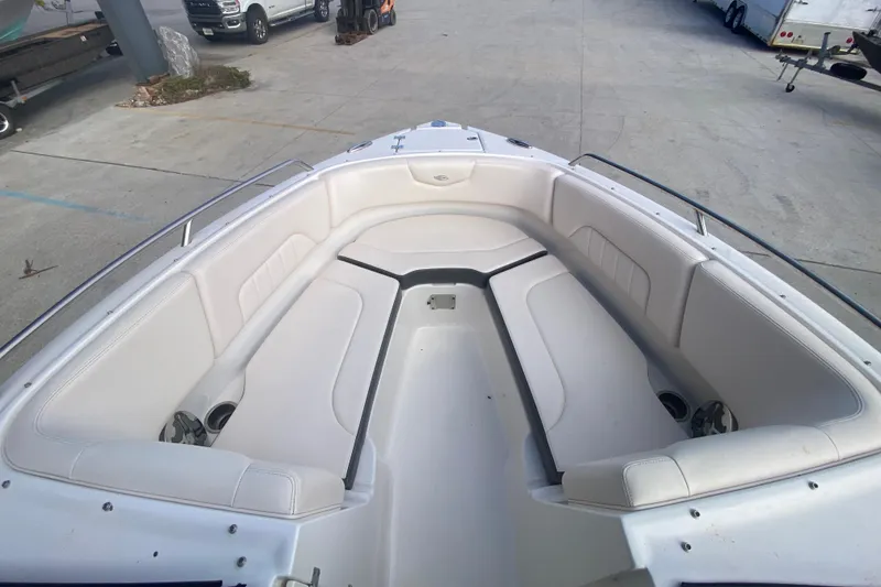 Slide: The Image of 2017 Chaparral 227 SSX boat interior with white seating and cup holders. - 22