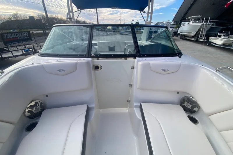 Slide: The Image of 2017 Chaparral 227 SSX boat interior with white seating and windshield. - 23