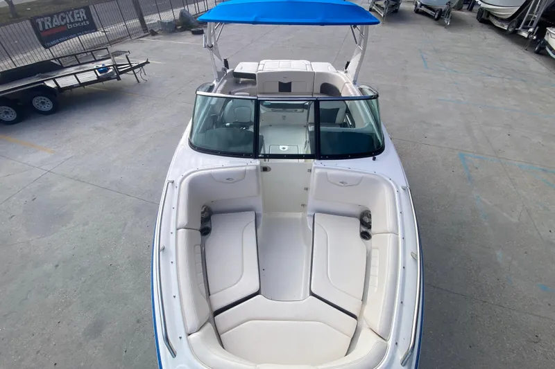 Slide: The Image of 2017 Chaparral 227 SSX boat with blue canopy and spacious seating. - 24
