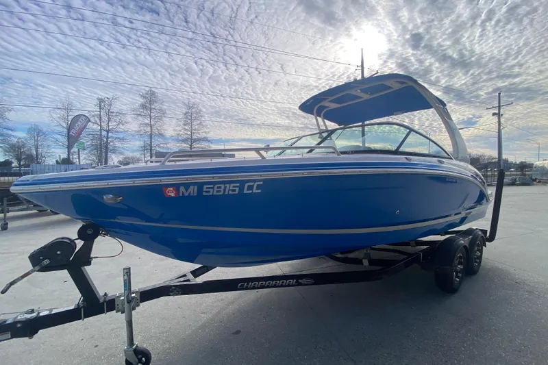 Slide: The Image of 2017 Chaparral 227 SSX boat on trailer under cloudy sky. - 7