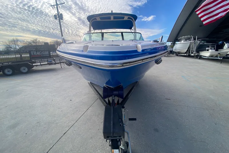Slide: The Image of 2017 Chaparral 227 SSX boat on trailer, under a partly cloudy sky. - 9