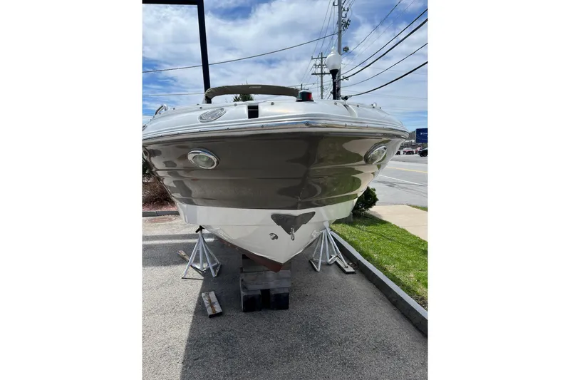 Slide: The Image of 2015 Cruisers Sport Series 258 Bow Rider boat on display outdoors. - 3