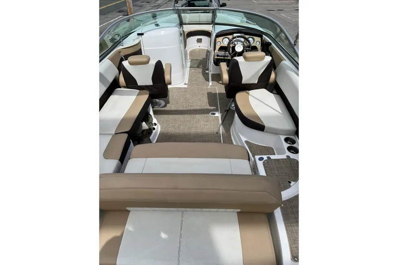 Slide: The Image of 2015 Cruisers Sport Series 258 Bow Rider interior with beige and white seating. - 4