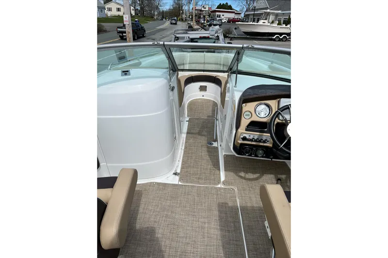 Slide: The Image of 2015 Cruisers Sport Series 258 Bow Rider interior with steering wheel and seating. - 5