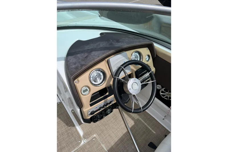 Slide: The Image of 2015 Cruisers Sport Series 258 Bow Rider dashboard with steering wheel and gauges. - 6