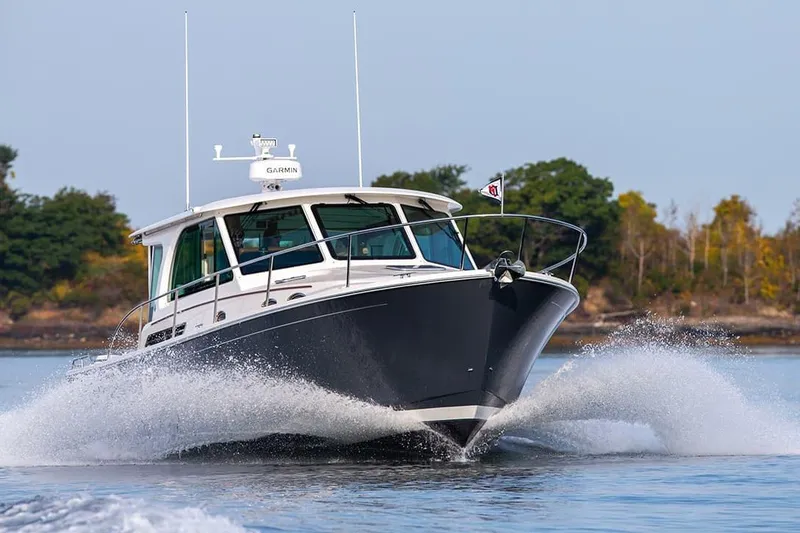 Slide: The Image of Manufacturer Provided Image: 2026 Back Cove 39O cruising on water, creating a dynamic splash. - 2