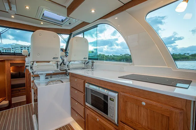 Slide: The Image of Manufacturer Provided Image: Luxurious interior of 2026 Back Cove 39O yacht with modern kitchen and seating. - 5