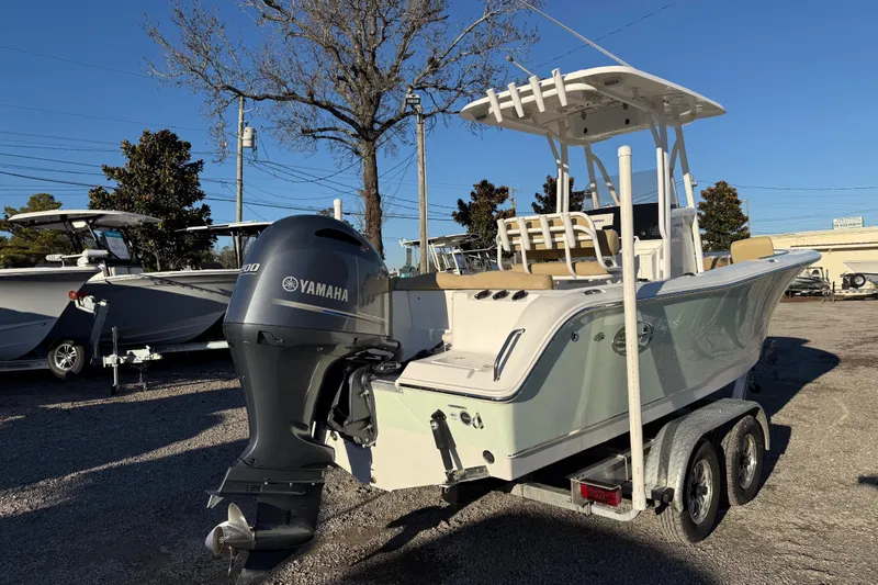 Slide: The Image of 2018 Sea Hunt Ultra 225 boat with Yamaha engine on trailer, parked outdoors. - 8