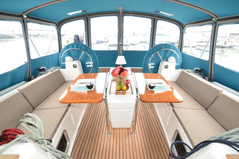 Slide: The Image of 2014 Jeanneau Sun Odyssey 469 sailboat docked under clear blue sky. - 10