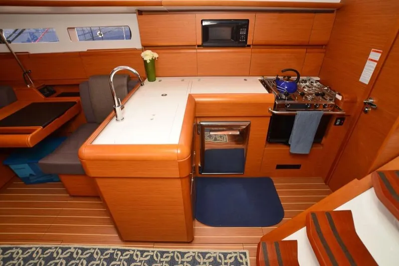 Slide: The Image of 2014 Jeanneau Sun Odyssey 469 sailboat docked at marina, view from deck. - 15