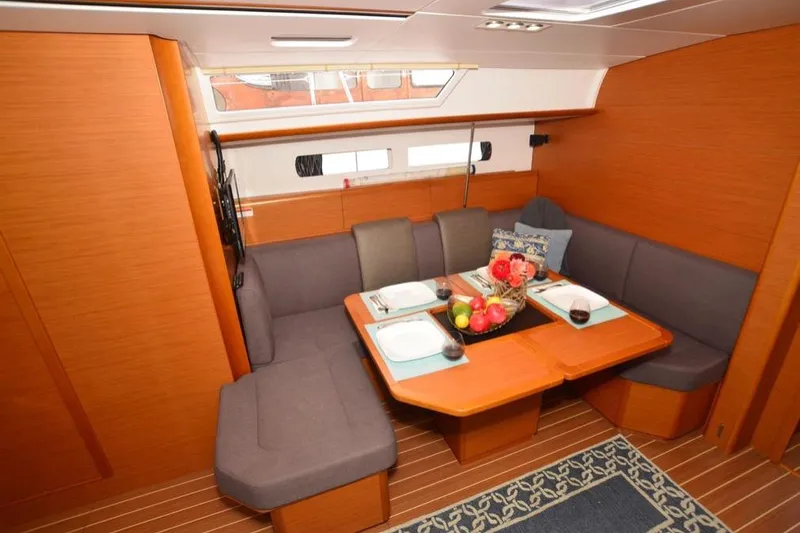 Slide: The Image of Storage compartment of 2014 Jeanneau Sun Odyssey 469 with colorful sail and equipment. - 18