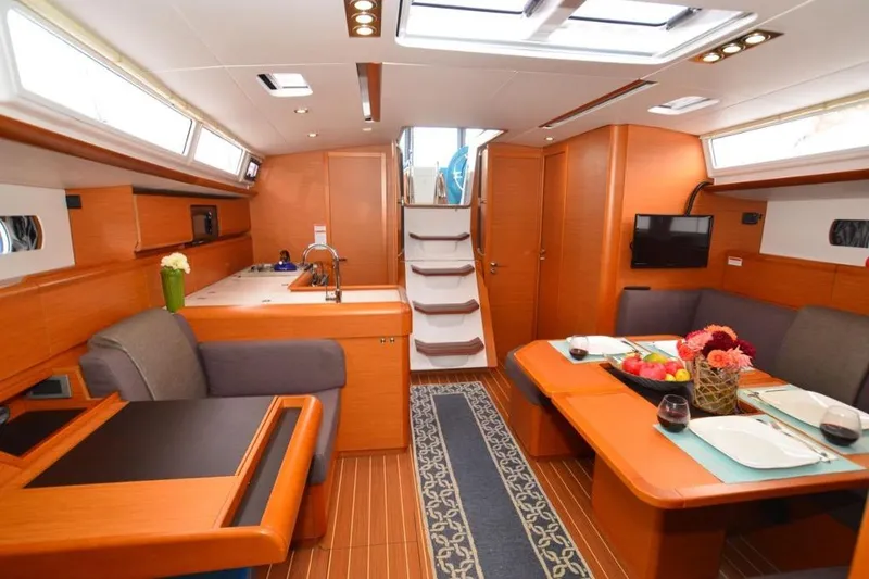 Slide: The Image of 2014 Jeanneau Sun Odyssey 469 sailboat deck with anchor chain and winch. - 21