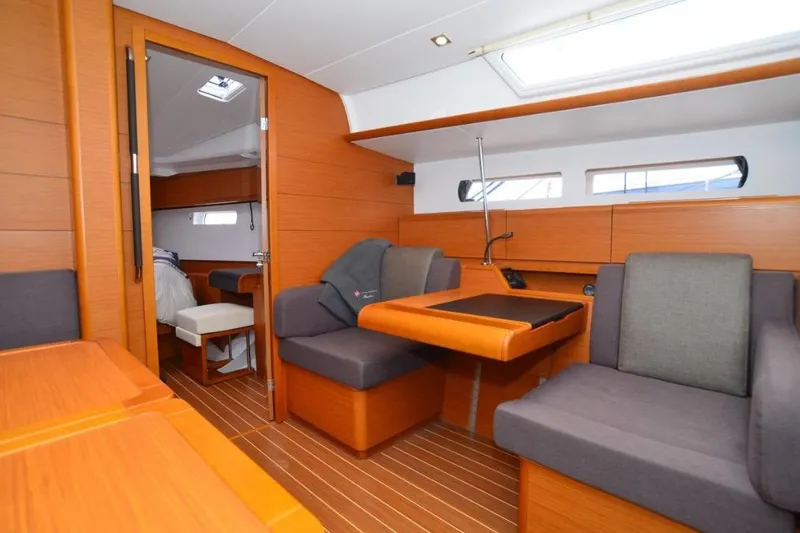 Slide: The Image of 2014 Jeanneau Sun Odyssey 469 sailboat deck view in marina setting. - 22