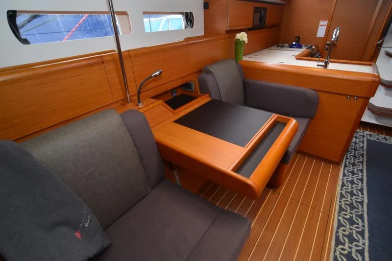 Slide: The Image of 2014 Jeanneau Sun Odyssey 469 sailboat mast and rigging in marina. - 24