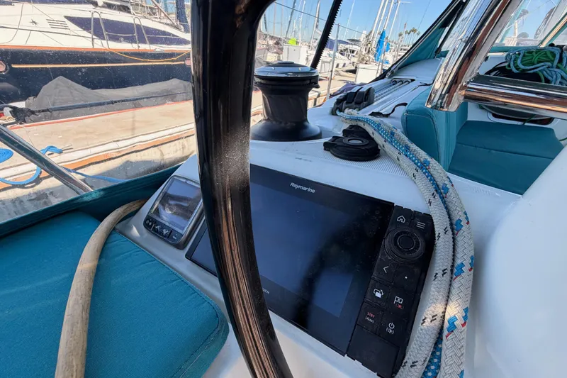 Slide: The Image of Cockpit of 2014 Jeanneau Sun Odyssey 469 with navigation equipment and ropes. - 36