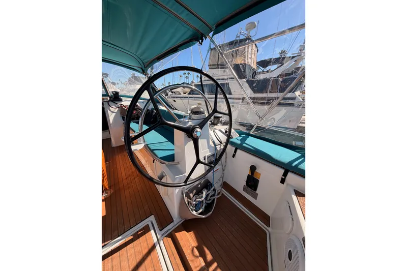 Slide: The Image of 2014 Jeanneau Sun Odyssey 469 cockpit with steering wheel and teak flooring. - 38