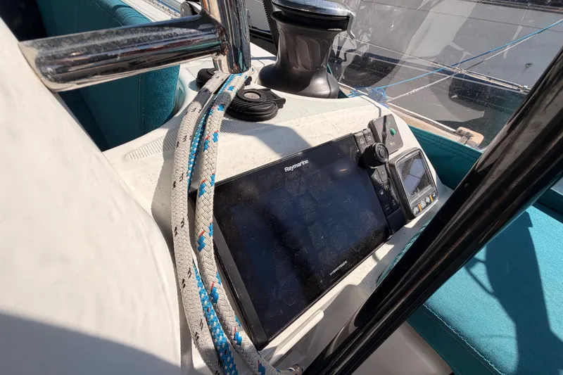 Slide: The Image of Cockpit of 2014 Jeanneau Sun Odyssey 469 with navigation equipment and ropes. - 39