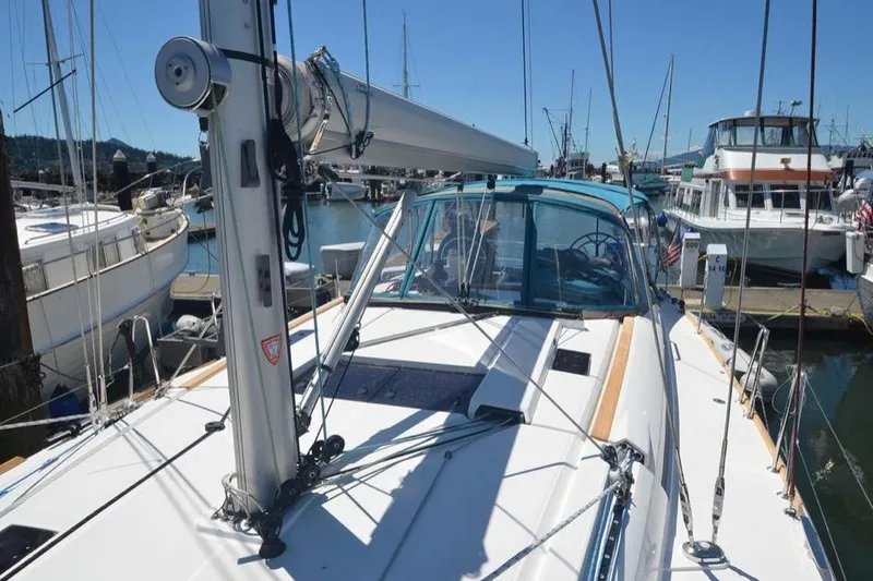 Slide: The Image of 2014 Jeanneau Sun Odyssey 469 sailboat docked in a sunny marina. - 4