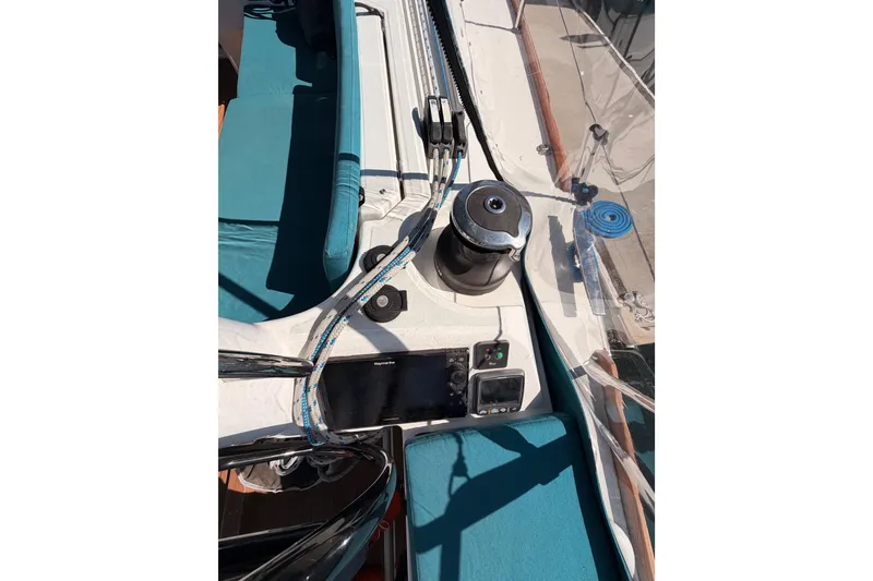 Slide: The Image of 2014 Jeanneau Sun Odyssey 469 sailboat deck with winch and navigation equipment. - 40