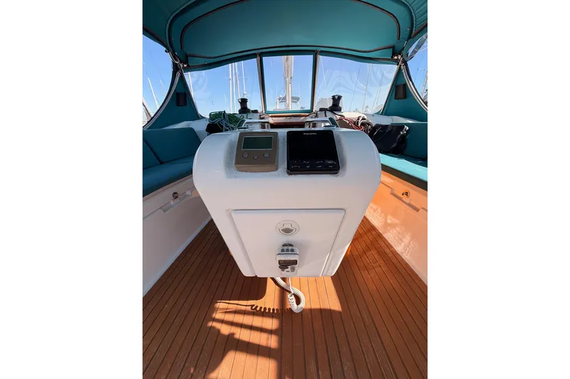 Slide: The Image of Cockpit of 2014 Jeanneau Sun Odyssey 469 sailboat with navigation equipment. - 41