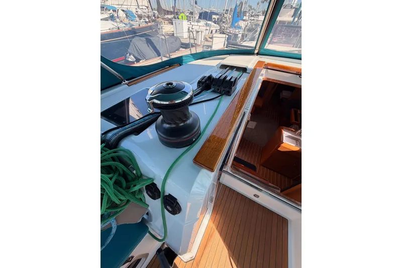 Slide: The Image of 2014 Jeanneau Sun Odyssey 469 yacht deck with winch and green rope. - 44