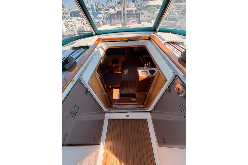 Slide: The Image of Interior view of 2014 Jeanneau Sun Odyssey 469 sailboat, showcasing cabin and seating area. - 46