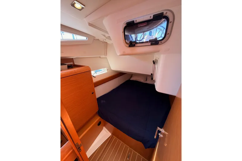 Slide: The Image of Cozy cabin interior of 2014 Jeanneau Sun Odyssey 469 sailboat with wooden finishes. - 54