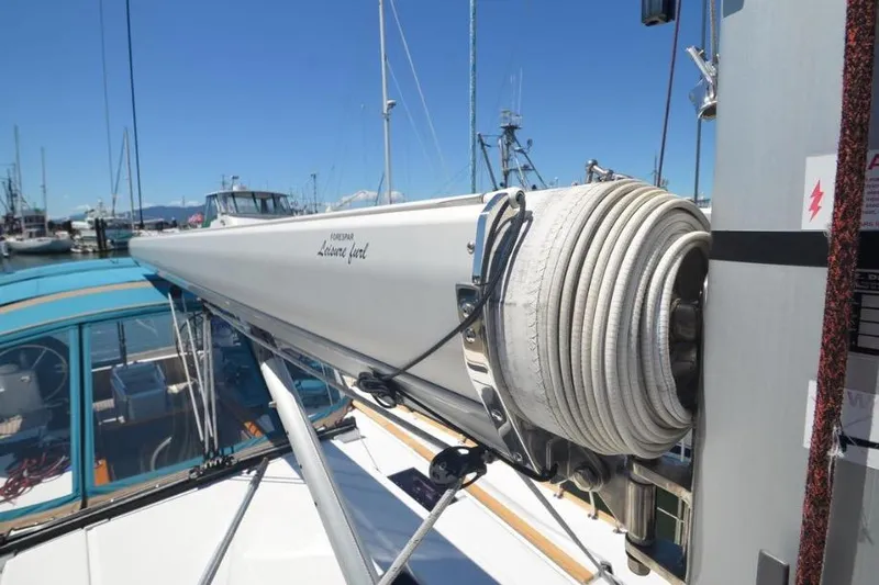 Slide: The Image of 2014 Jeanneau Sun Odyssey 469 sailboat docked in marina, front view. - 6