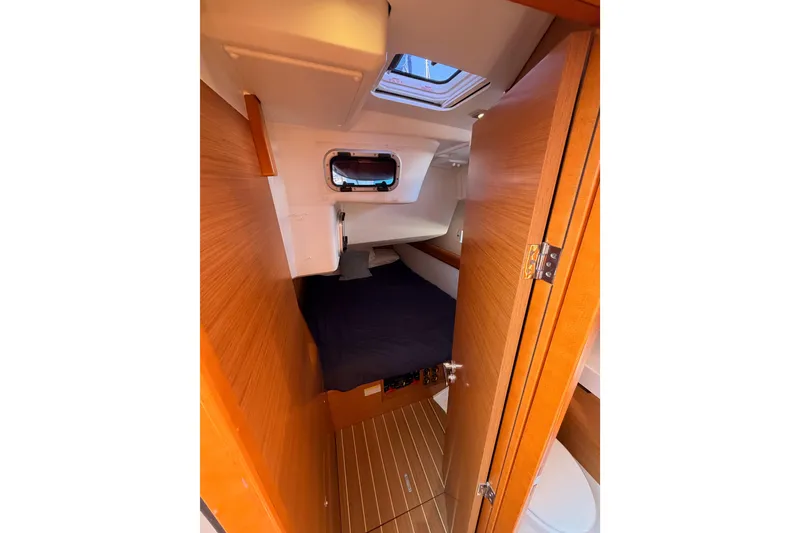 Slide: The Image of Cozy cabin interior of 2014 Jeanneau Sun Odyssey 469 sailboat with wooden finish. - 62