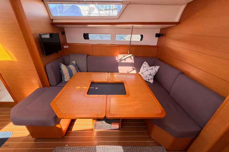 Slide: The Image of Interior of 2014 Jeanneau Sun Odyssey 469 yacht with cozy seating and wooden table. - 68