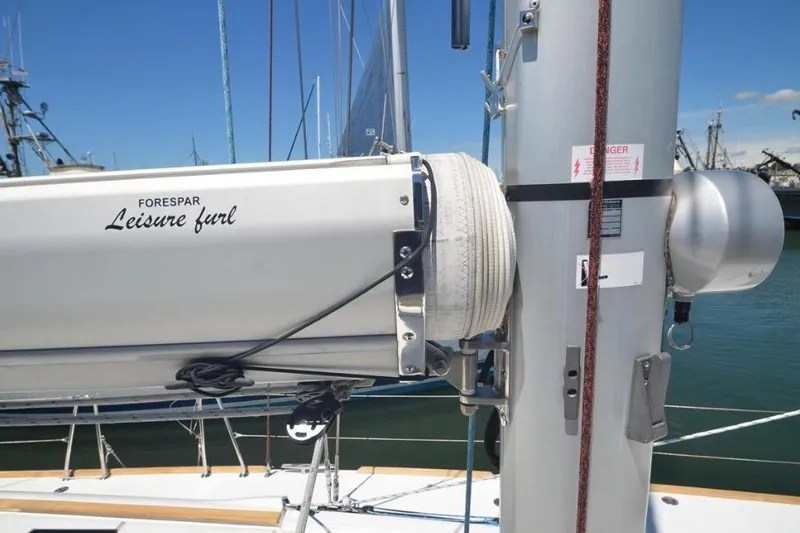 Slide: The Image of 2014 Jeanneau Sun Odyssey 469 sailboat bow with anchor at marina. - 7