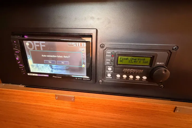 Slide: The Image of Control panel on 2014 Jeanneau Sun Odyssey 469 with Pioneer display and Magnum charger. - 70