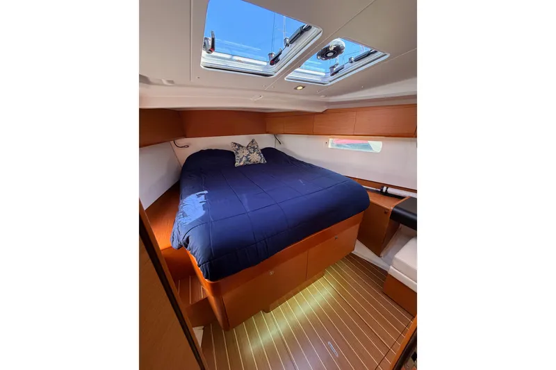 Slide: The Image of Cozy cabin interior of 2014 Jeanneau Sun Odyssey 469 with skylight and wooden flooring. - 92