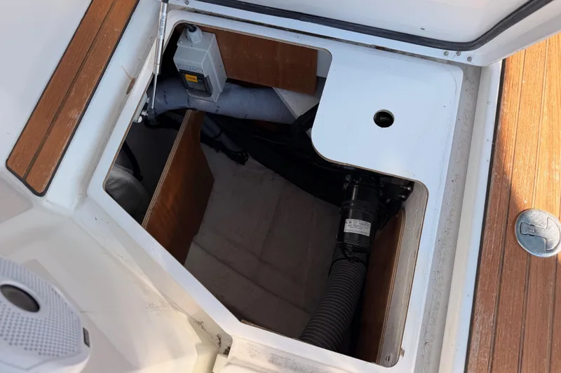 Slide: The Image of Open hatch on 2014 Jeanneau Sun Odyssey 469, revealing storage and mechanical components. - 99