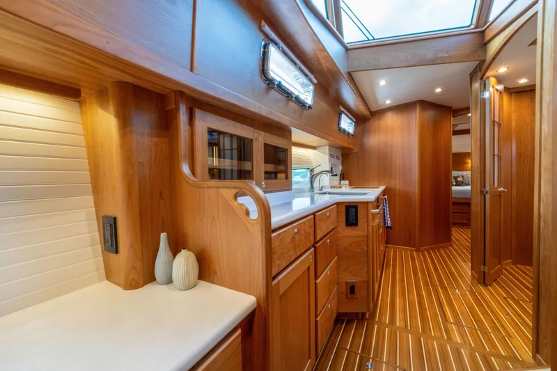 Slide: The Image of Luxurious interior of 2027 Sabre 51 Salon Express yacht with wooden cabinetry and modern amenities. - 16