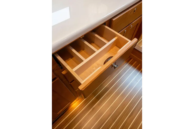 Slide: The Image of Open wooden drawer in Sabre 51 Salon Express 2027, showcasing interior compartments. - 18