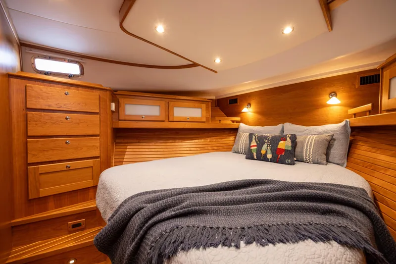 Slide: The Image of Luxurious cabin interior of 2027 Sabre 51 Salon Express yacht with cozy bedding. - 22