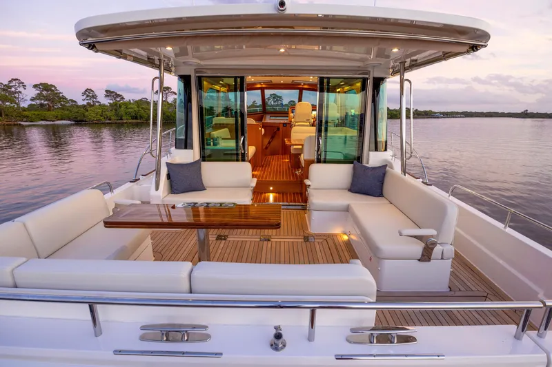 Slide: The Image of Manufacturer Provided Image: 2026 Sabre 51 Salon Express yacht on calm water, side view. - 5