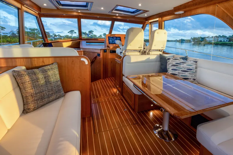 Slide: The Image of 2026 Sabre 51 Salon Express yacht with elegant interior and scenic water view. - 7