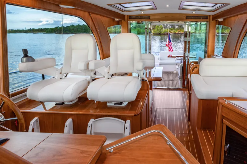 Slide: The Image of Luxurious 2027 Sabre 51 Salon Express yacht interior with scenic water view. - 8