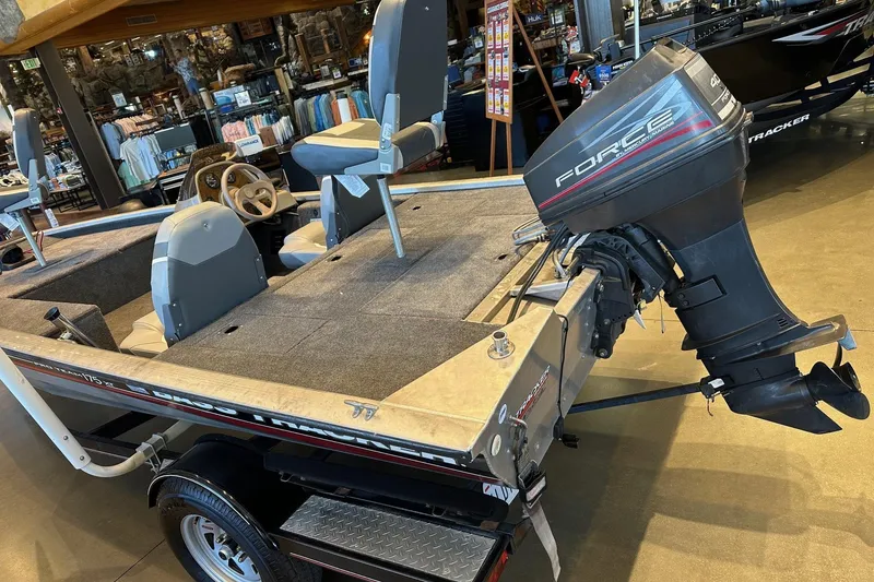 Slide: The Image of 2002 Tracker Pro Team 175 boat with Force outboard motor in showroom. - 3