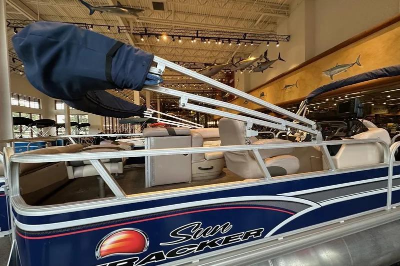 Slide: The Image of 2015 Sun Tracker Fishin' Barge 22 DLX pontoon boat in showroom display. - 4