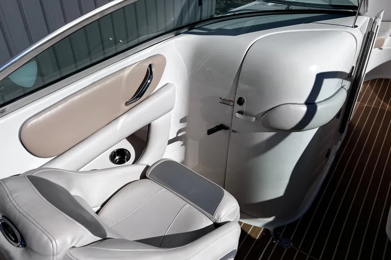 Slide: The Image of 2005 Chaparral Sunesta 254 boat interior with white seating and sleek design. - 11