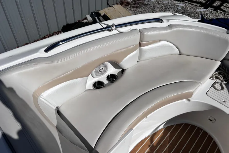 Slide: The Image of 2005 Chaparral Sunesta 254 boat interior with curved seating and cup holders. - 15