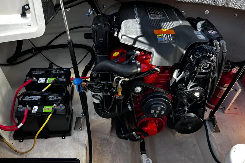 Slide: The Image of 2005 Chaparral Sunesta 254 engine compartment with batteries and Volvo Penta engine. - 20