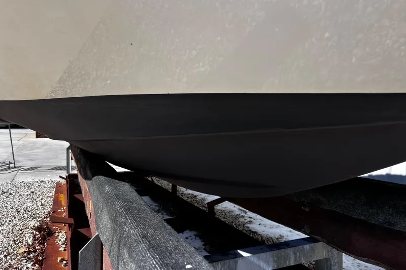 Slide: The Image of 2005 Chaparral Sunesta 254 boat hull on trailer, close-up view. - 24