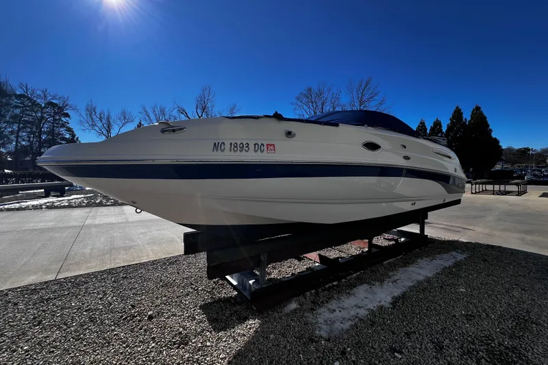 Slide: The Image of 2005 Chaparral Sunesta 254 boat on display under clear blue sky. - 5