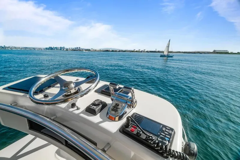 Slide: The Image of Helm of Cabo 35 Express 2005 on open sea. - 11